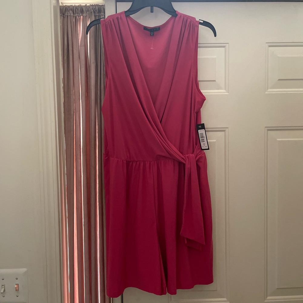 Pink romper with tie front.
